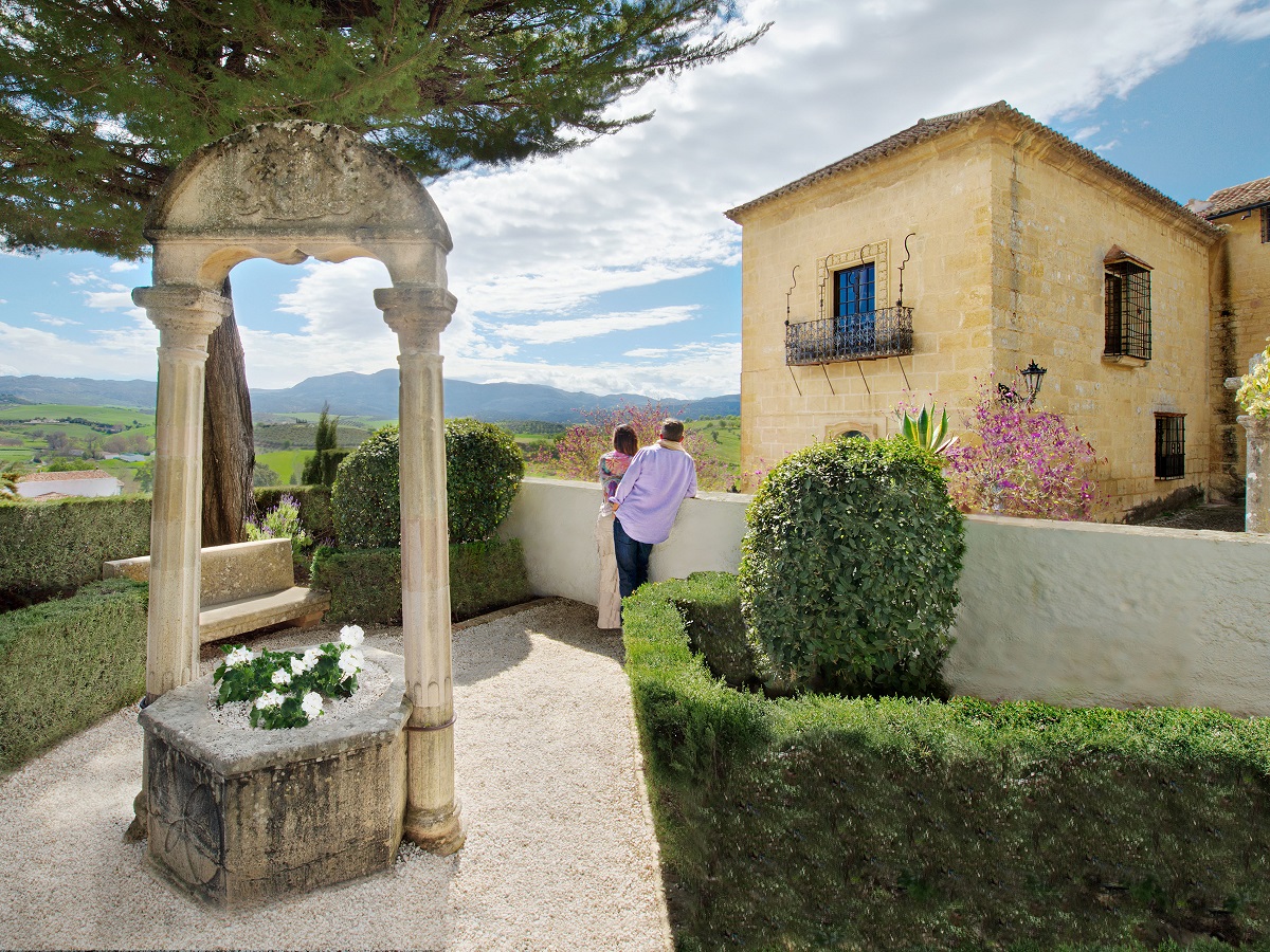 Couple admiring a view from a court yard. One of many Specialty Package experiences.