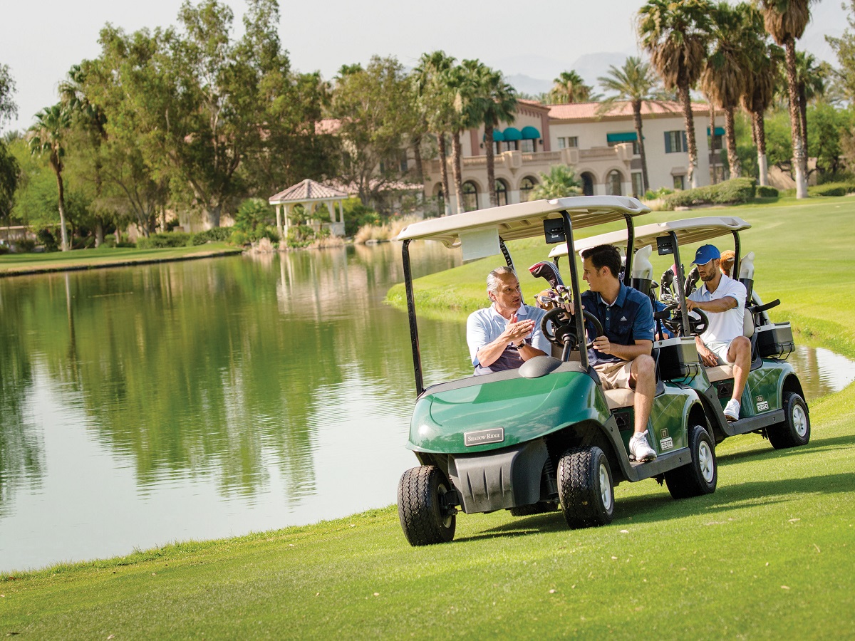 Golfers driving their golf carts on vacation.