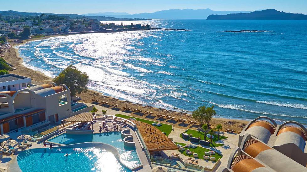View overlooking Domes Noruz Chania hotel's pool and beach, part of the Autograph Collection.