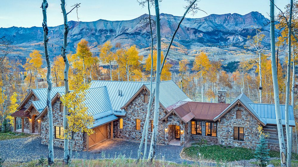 Petra Domus villa in Telluride Colorado, front exterior view with mountain backdrop.