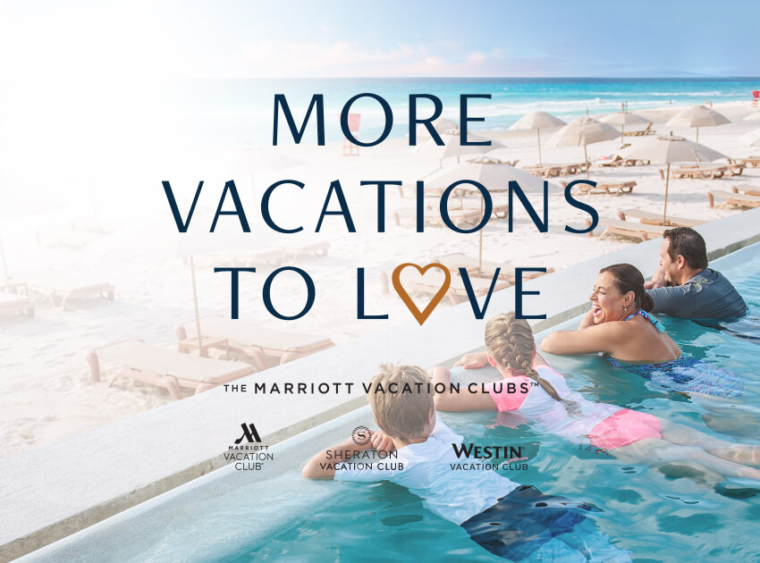 Family overlooks the beach and beach umbrellas from an infinity pool on vacation